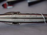a silver and red model of a space ship on a table