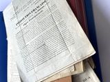 a pile of old papers on top of each other