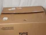 a box that is sitting on the floor next to a wall