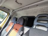 a view of the inside of a van with the seats folded down