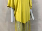 a woman ' s yellow dress with fringes on a mannequin mannequin mannequin mann