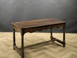 an old wooden table sitting on top of a hard wood floor