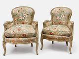 pair of louis xv style upholstered armchairs with floral upholstered cushions
