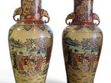 pair of oriental vases on a white background with a white background