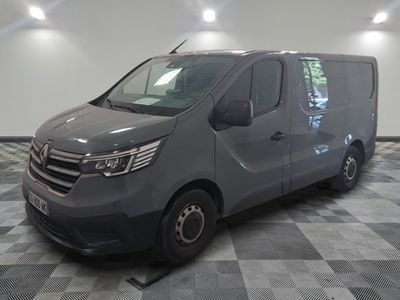 the grey van is parked on a checkered floor in the garage