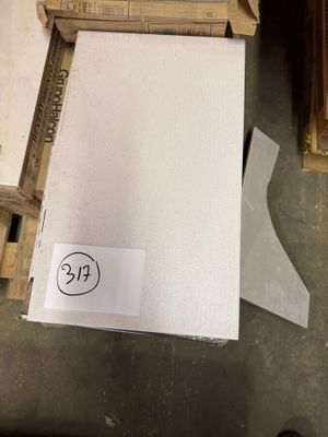 a stack of boxes with a price tag on top of them