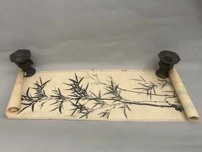 an old scroll with a painting of a bamboo tree on it