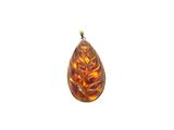 an image of a glass pendant with a leaf design on it