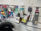a picture of a bunch of office supplies hanging on a wall