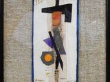 framed artwork of a painting of a cross and an egg on a piece of paper