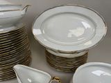 a lot of plates and bowls that are stacked together