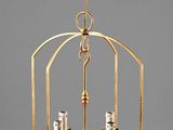 an image of a brass hanging light fixture with two candles
