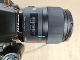 a close up of a camera lens on a tripod