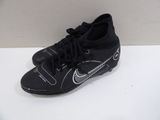a close up of a pair of soccer shoes on a table