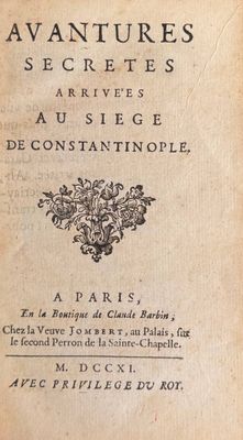an old book with black writing on it sitting on top of a table