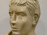 marble bust of a young man with a button on his collar