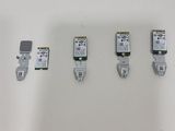 four different types of electronic devices are displayed on a white surface