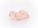 a pink quartz stone on a white background