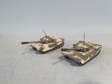 two toy tanks that are sitting on top of each other