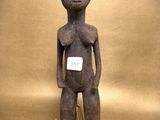 a statue of a person with a tag on it ' s chest