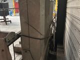 a picture of a machine that is working on a piece of metal