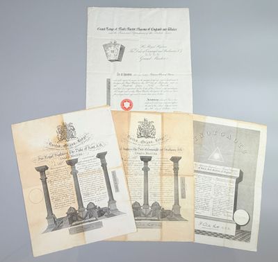 three old papers with a red cross on them sitting on top of a table