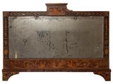 a mirror with a wooden frame on top of it