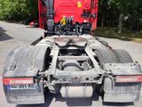 a red truck that is parked on the side of the road