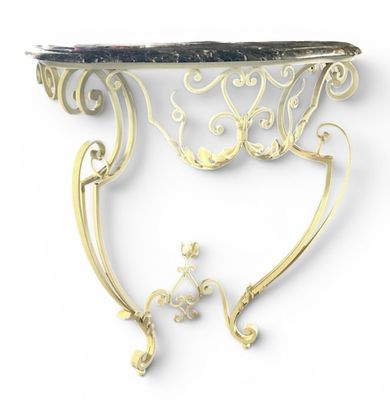 a silver and gold table with a marble top on it