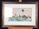 framed watercolor painting of a village with a palm tree in the foreground