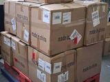 many boxes stacked on a pallet in a warehouse