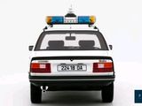a white police car with a blue light on top of it