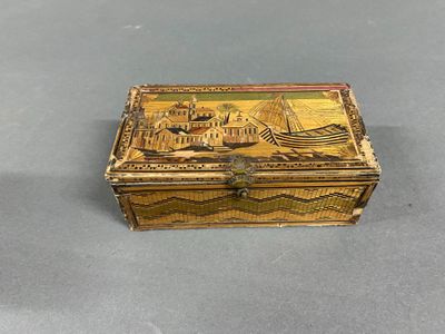 an old wooden box with a painting on it sitting on a table
