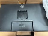 laptop in a cardboard box with a plastic bag on top of it