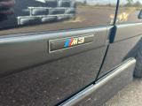 a bmw emblem on the side of a black car