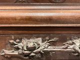 a close up of a wooden table with carvings on it