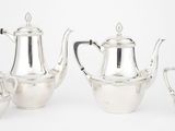 un ensemble composé de quatre théières en argent et d'une cafetière