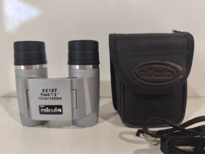 two binoculars that are sitting on a table