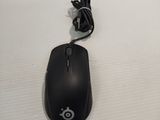 a computer mouse sitting on top of a white surface