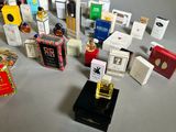 a lot of different types of perfumes on the table