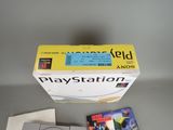 a video game on the table next to the box