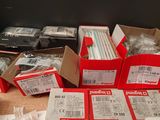 many boxes of electronic equipment sitting on a table