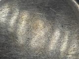 a metal pan that has a lot of hair on it