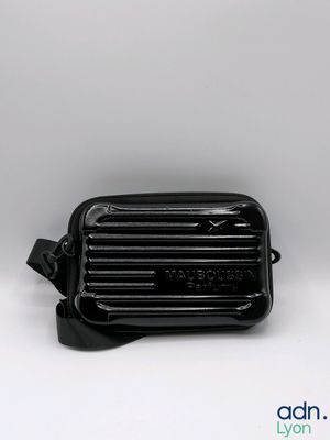 a close up of a black bag on a white background