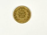 a close up of a gold coin on a white surface
