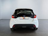 the back of a white toyota prius parked in a room