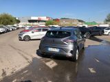 many cars parked in a parking lot in a parking lot