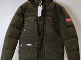 a close up of a jacket hanging on a wall