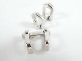 pair of silver plated earrings on white surface with white background