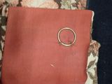 a ring sitting on top of a piece of cloth